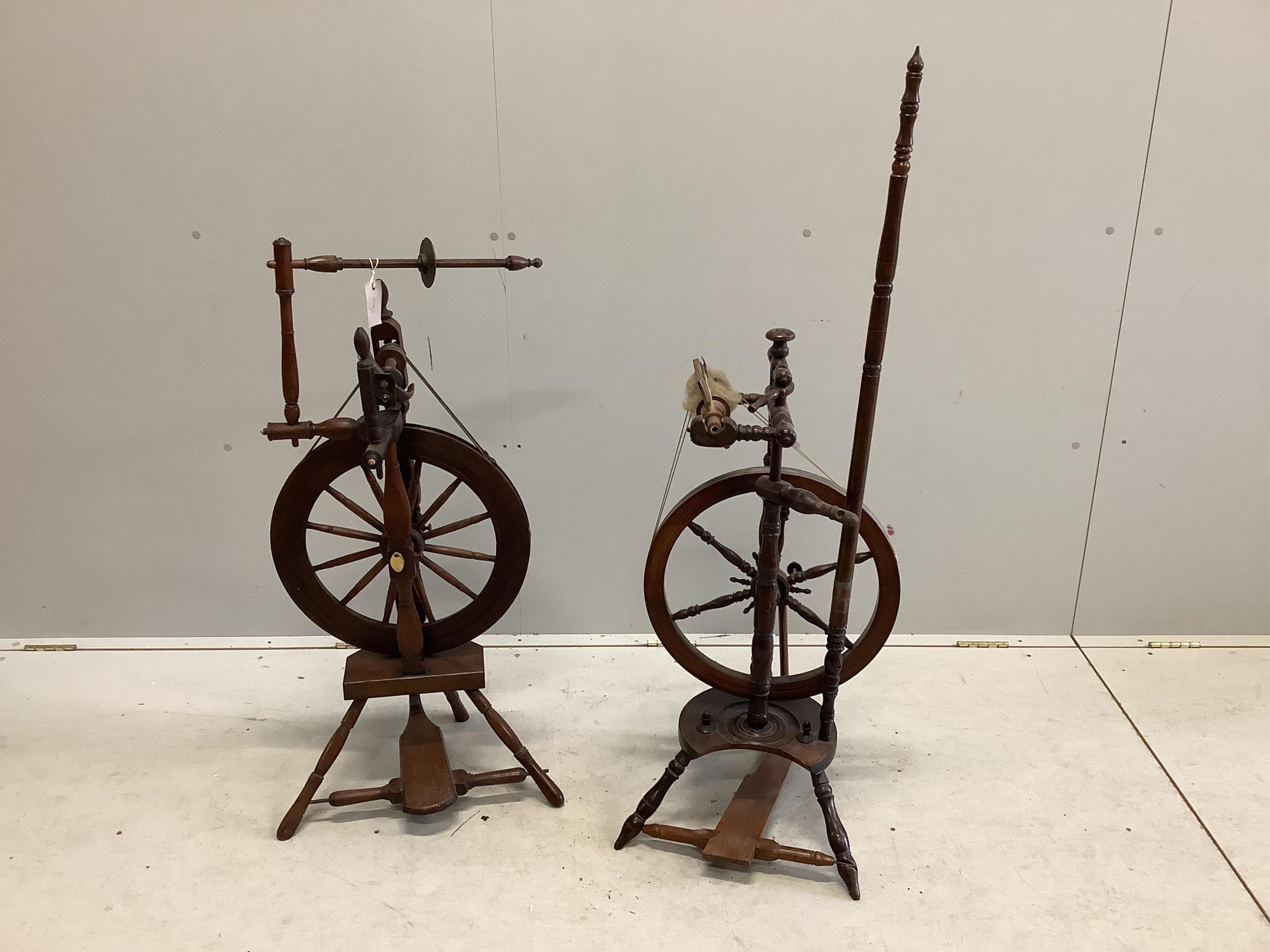 Two 19th century spinning wheels, larger height 124cm. Condition - fair